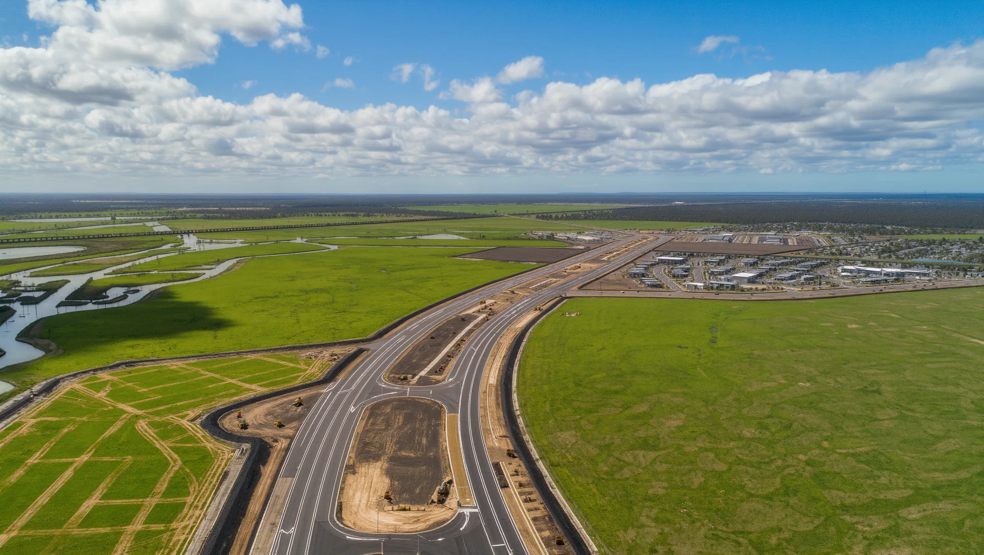 Aerial artist's impression of the future Melton East community with green open space and neighbourhood streets